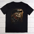 Black t-shirt with a graphic of a skull wearing a cap on a wooden surface