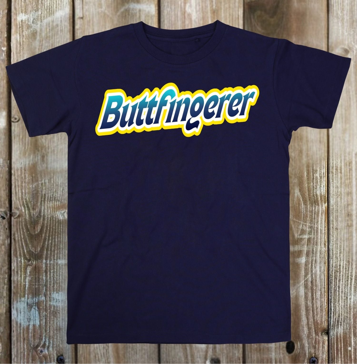 Navy blue t-shirt with 'Buttfingerer' text on a wooden background