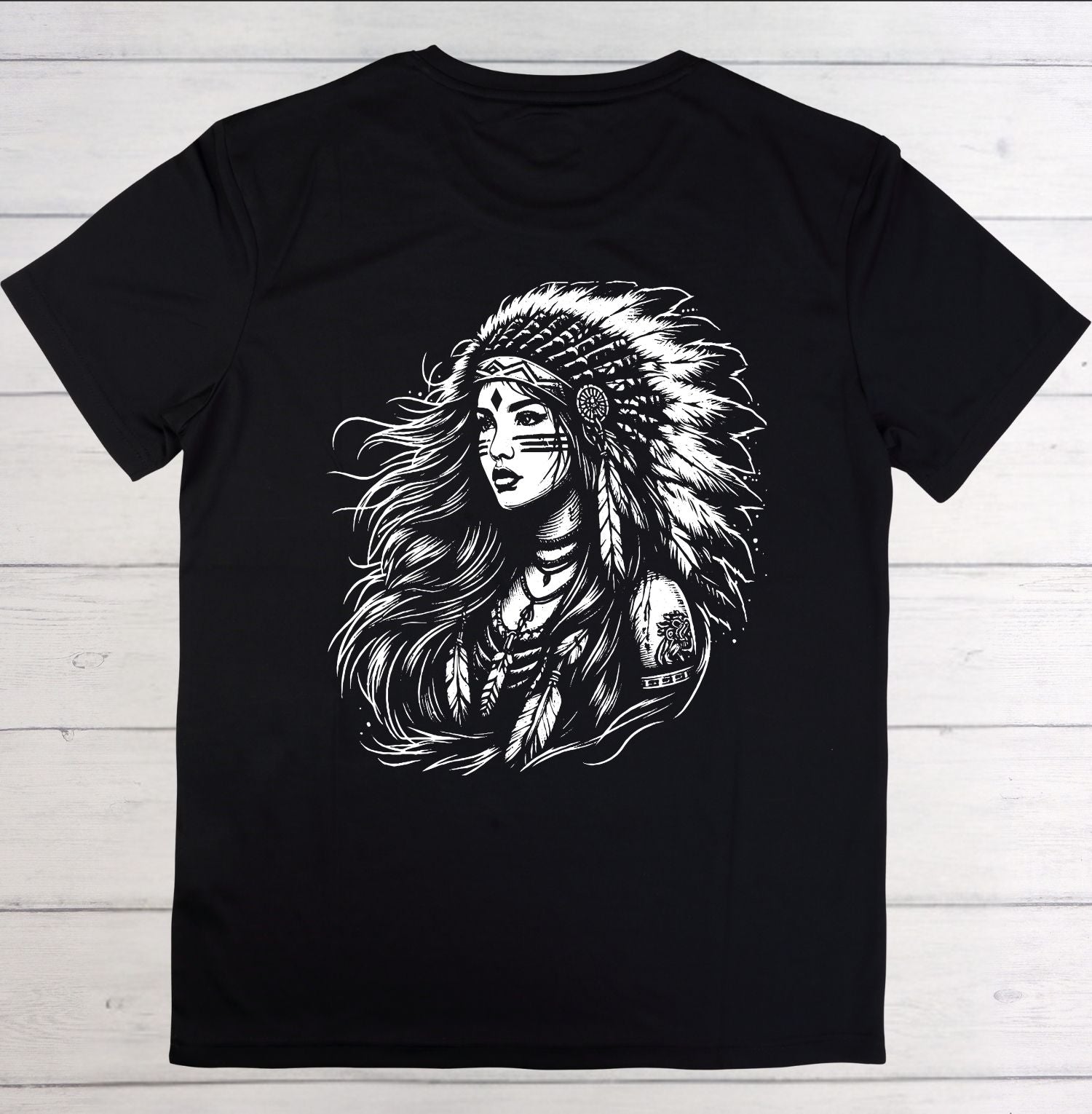 Black t-shirt with a graphic of a woman wearing an headdress on a wooden background