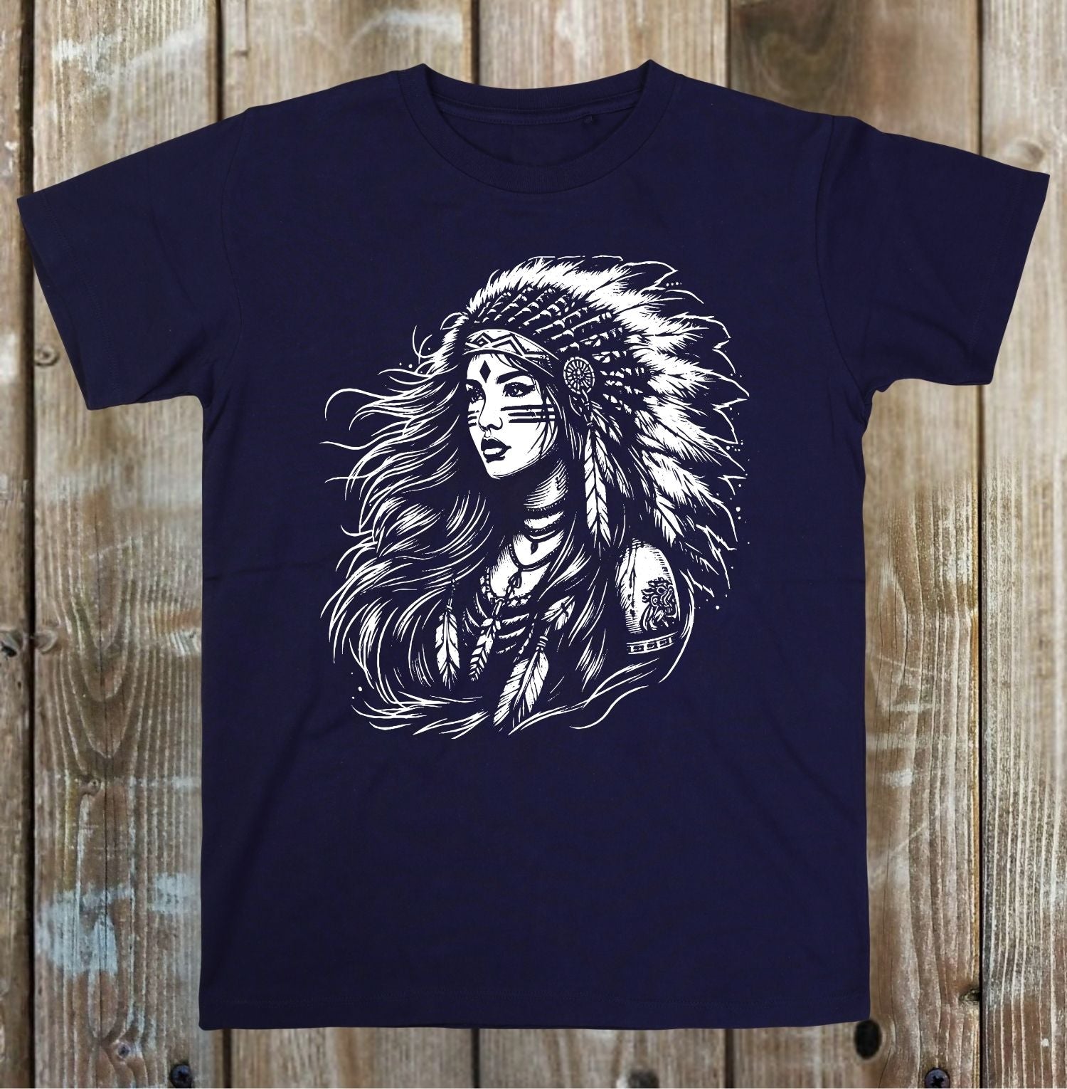Navy blue t-shirt with a graphic of a woman wearing a headdress on a wooden background
