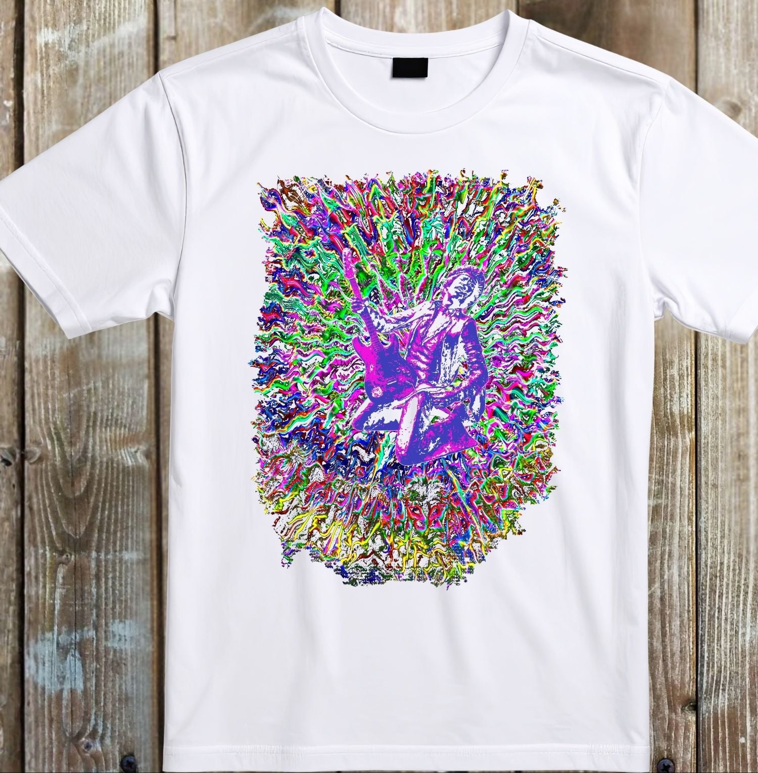 White t-shirt with a colorful graphic design on a wooden surface