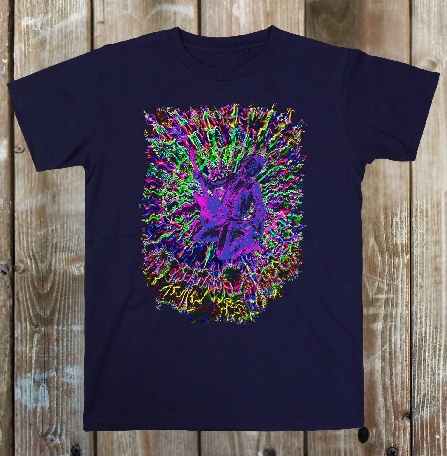 Navy blue t-shirt with a colorful graphic design on a wooden surface