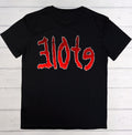 A black short-sleeve t-shirt with the word 'slots' printed across the chest in a stylized red font with a white outline, laid flat on a white wood plank background.