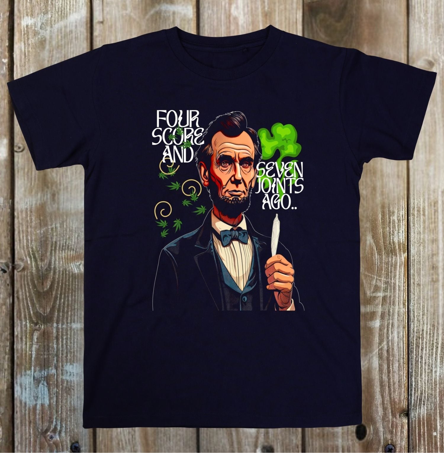 Black t-shirt with a graphic of Abraham Lincoln holding a lighter and text on a wooden background