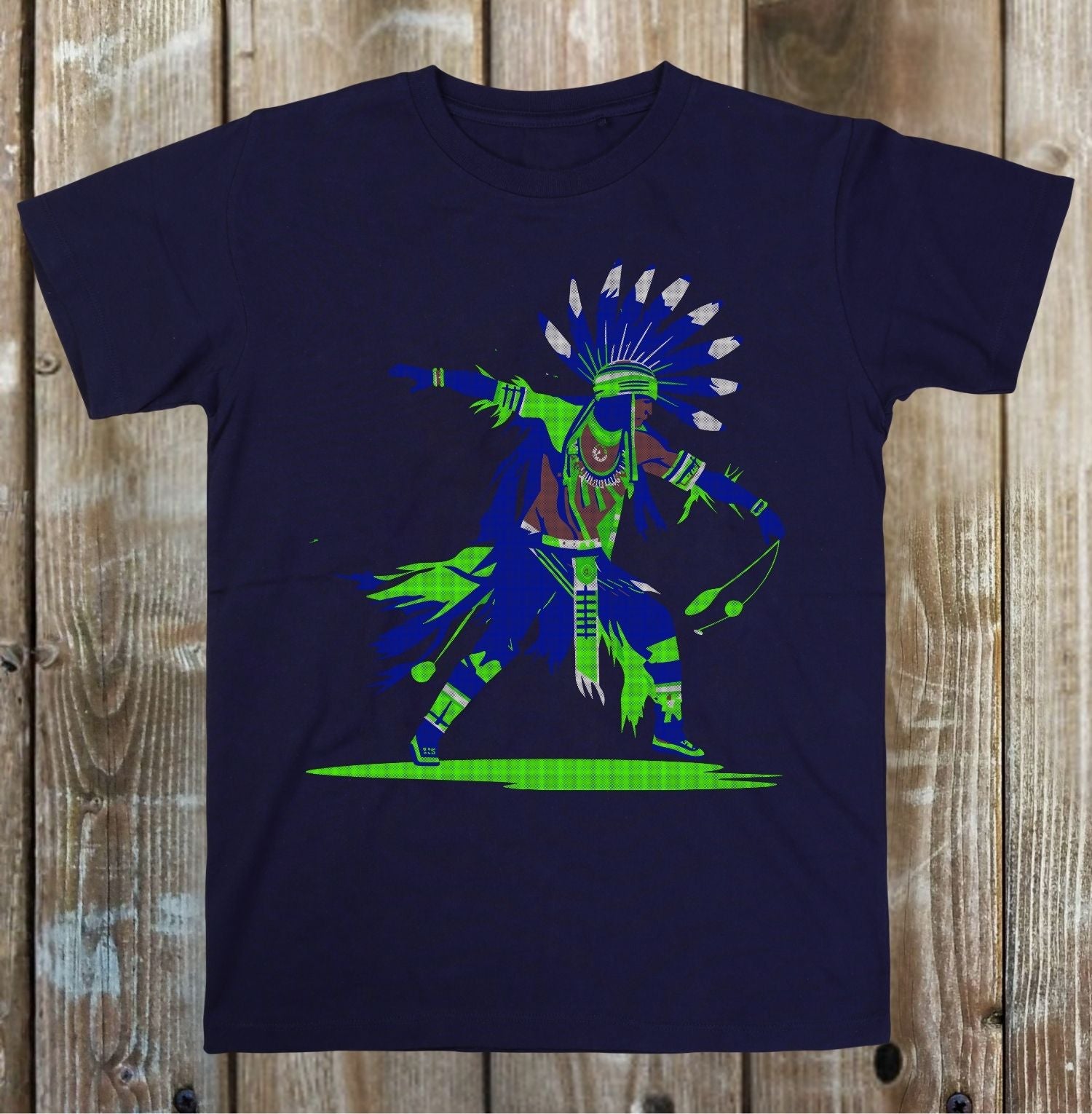 Navy blue t-shirt with a colorful graphic design on a wooden surface