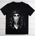 A black short-sleeve t-shirt with a high-contrast white graphic print of a woman wearing a patterned bandana and beanie, laid flat on a white wood plank background.
