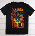 Black t-shirt with a colorful abstract design on a wooden surface