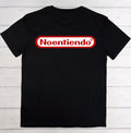A black short-sleeve t-shirt laid flat on a white wood plank background, featuring a red and white 'Noentiendo' logo graphic across the chest.