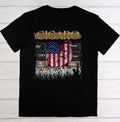 Black t-shirt with graphic design featuring an American flag and text on a wooden surface