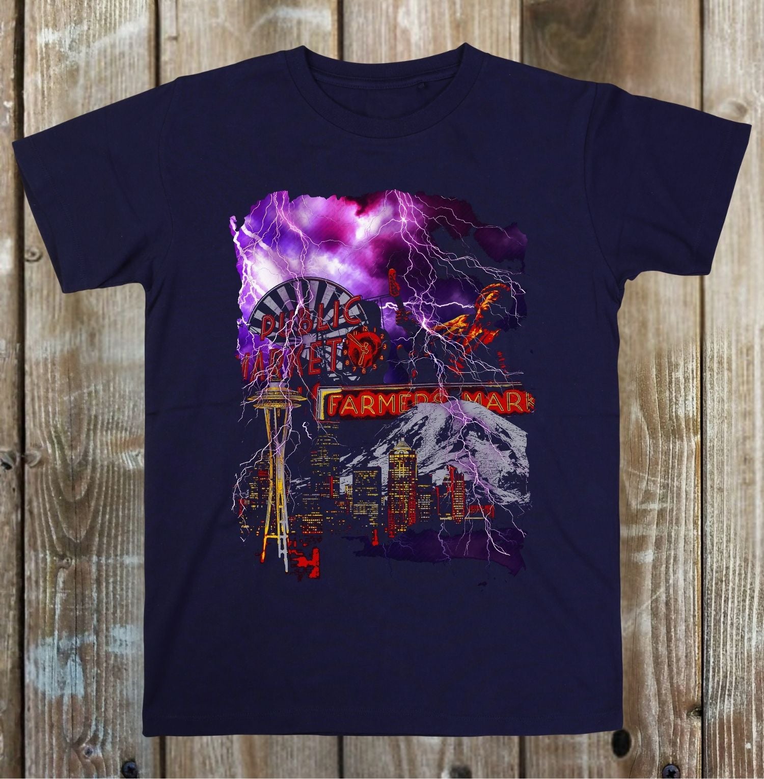 Navy blue t-shirt with a colorful graphic design on a wooden surface