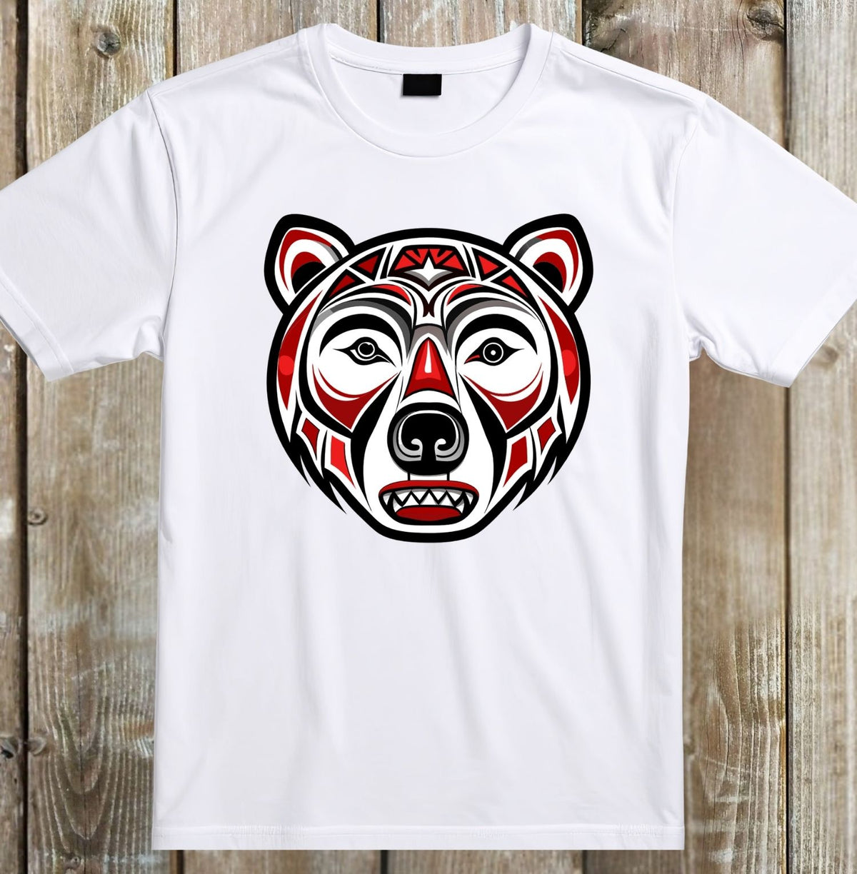 A white short-sleeve crewneck t-shirt featuring a stylized, geometric bear head graphic in red, black, and white on the chest, displayed flat against a rustic wooden plank background.
