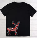 A black short-sleeve t-shirt laid flat on a white wood plank background, featuring a stylized red and white patterned deer graphic on the lower front.