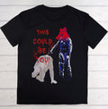Black t-shirt with graphic design of a person holding a bear and text 'THIS COULD BE YOU!' on a wooden background