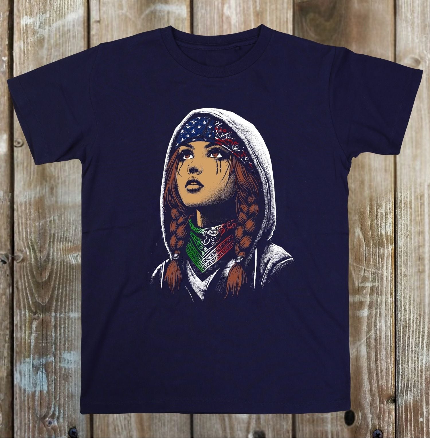 Navy blue t-shirt with a graphic of a person in a hoodie and bandanas on a wooden surface