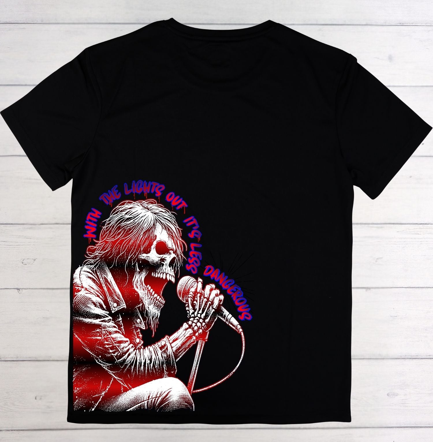 Black t-shirt with a graphic design of a skeleton holding a microphone on a wooden background
