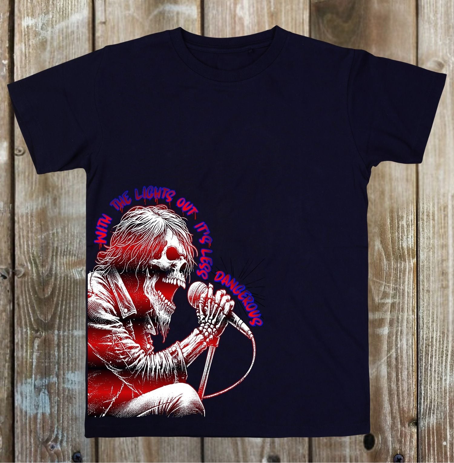 Black t-shirt with a graphic design of a skeleton holding a microphone on a wooden background