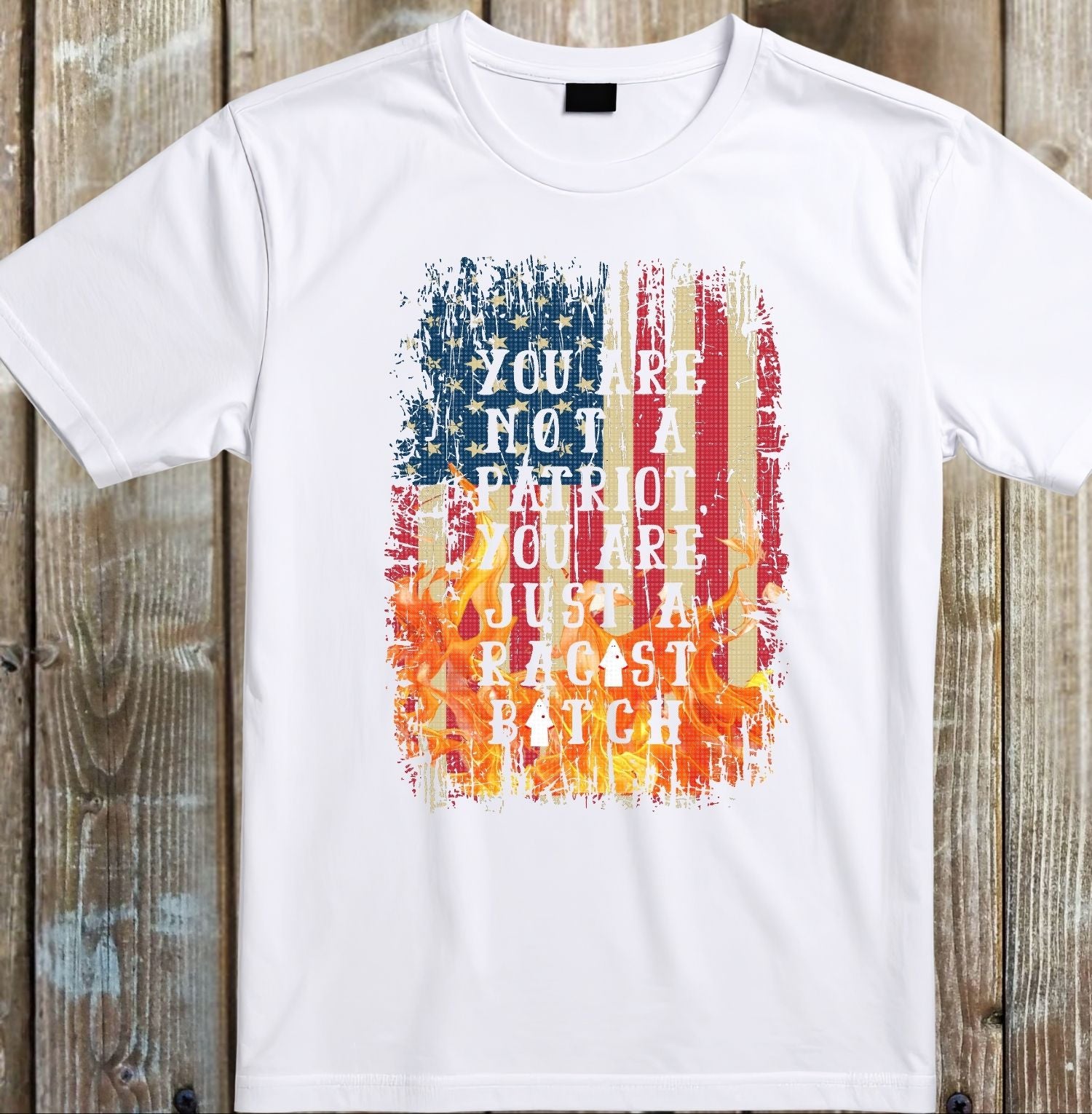 White t-shirt with colorful graphic and text on a wooden background